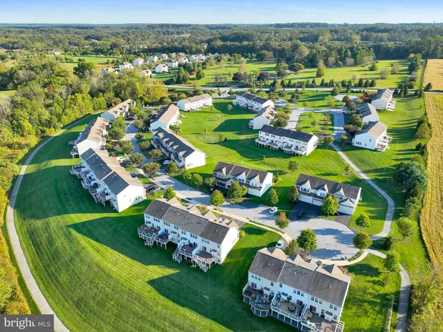 an aerial view of a house with a garden