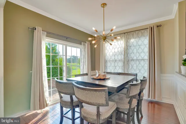 a dining room with furniture window wooden floor