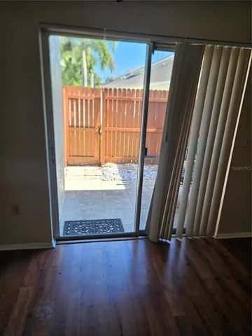 a view of front door with wooden floor