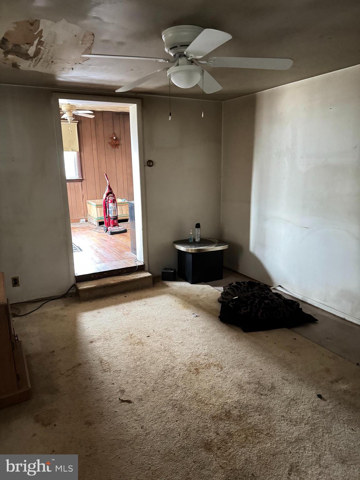 3847 Leeds Manor Road Markham, VA 22643 - Photo 11 of 17 a view of a garage with furniture and a ceiling fan