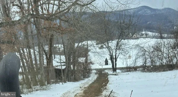 a view of a covered with snow in the yard