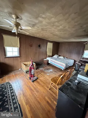 a bedroom with double bunk beds and window