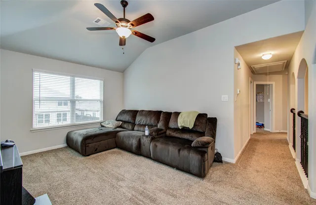 a living room with furniture and a window