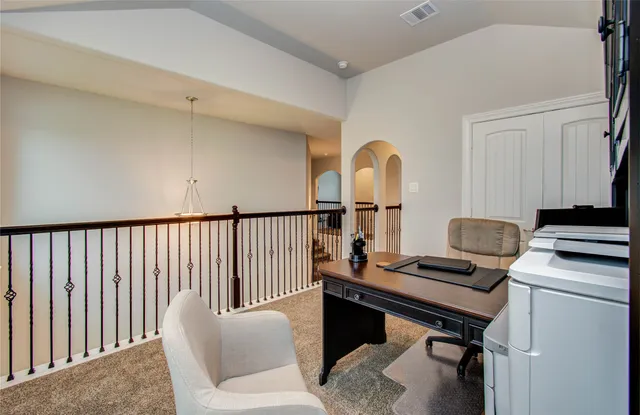 a view of workspace with wooden floor windows