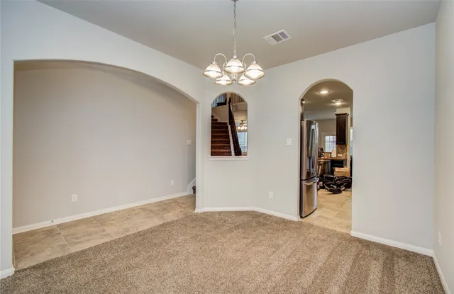 a view of a chandelier and entryway