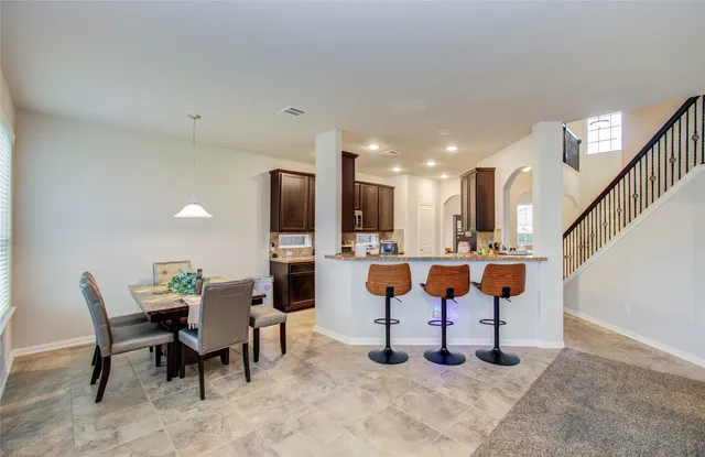 a view of kitchen with cabinets