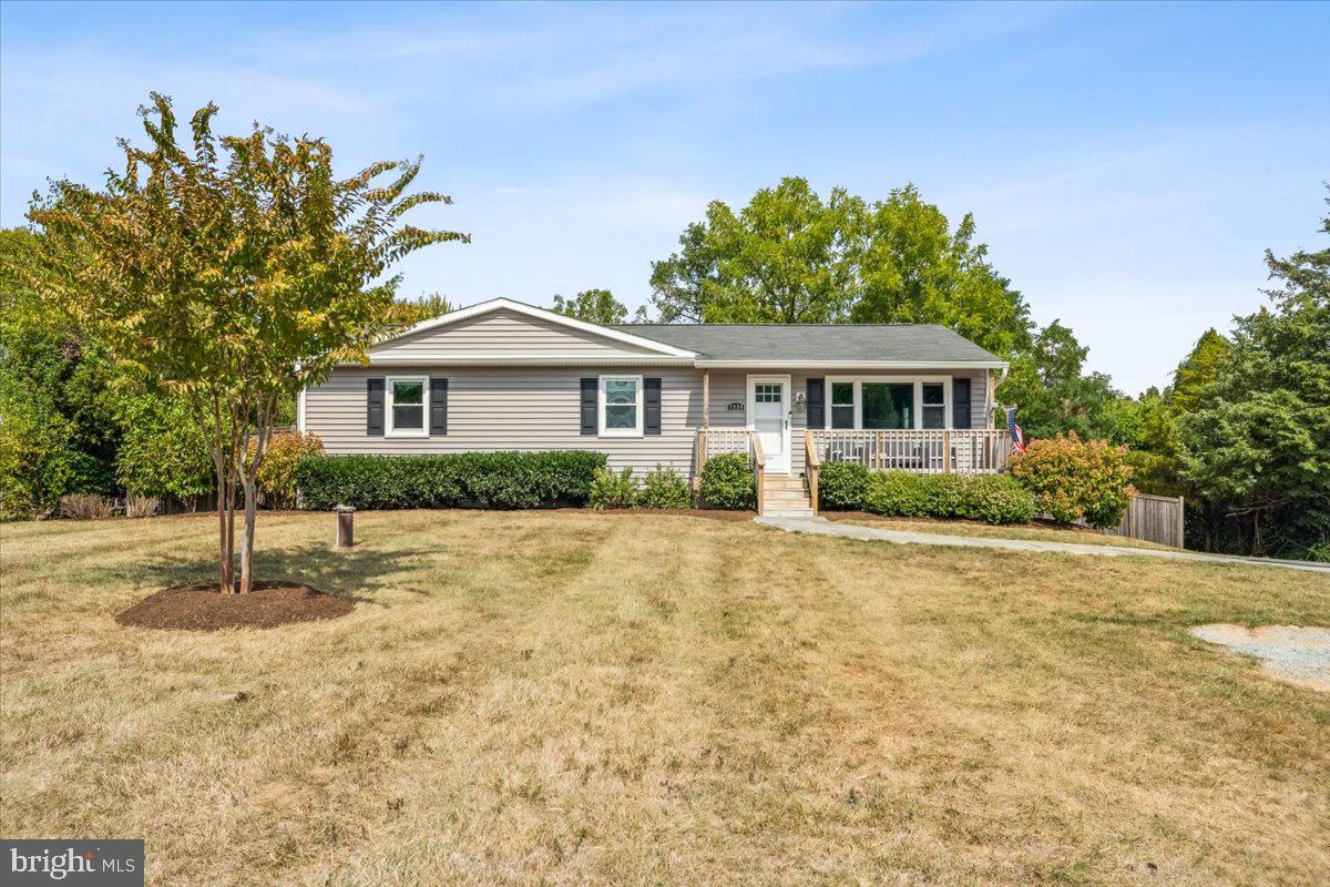 7830 Fingerboard Road Frederick, MD 21704 - Photo 1 of 39 a front view of a house with a garden