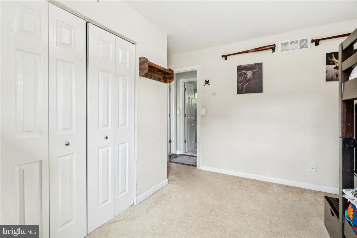 7830 Fingerboard Road Frederick, MD 21704 - Photo 15 of 39 a view of a hallway with wooden floor and closet