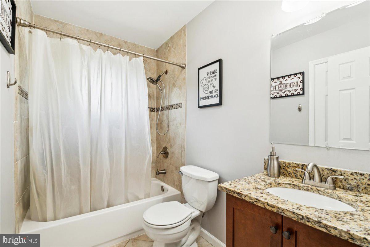 7830 Fingerboard Road Frederick, MD 21704 - Photo 16 of 39 a bathroom with a granite countertop sink mirror vanity and toilet