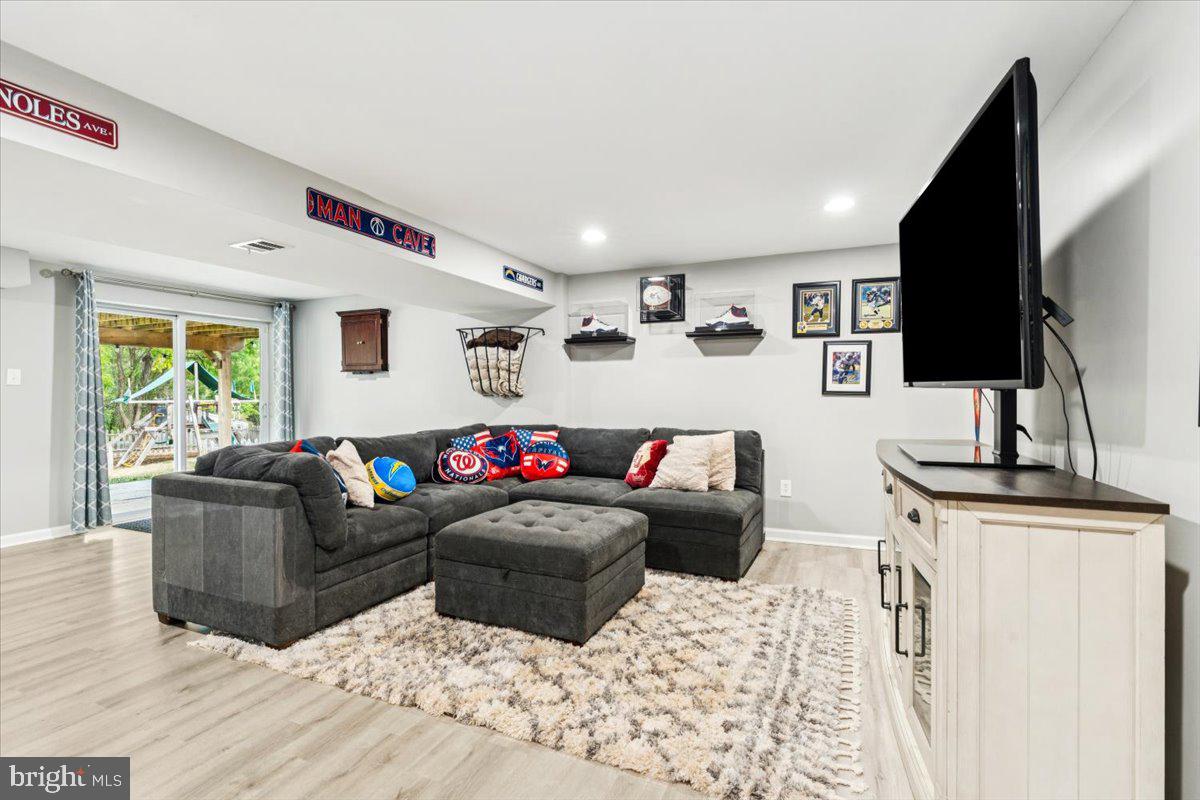 7830 Fingerboard Road Frederick, MD 21704 - Photo 19 of 39 a living room with furniture window and a flat screen tv