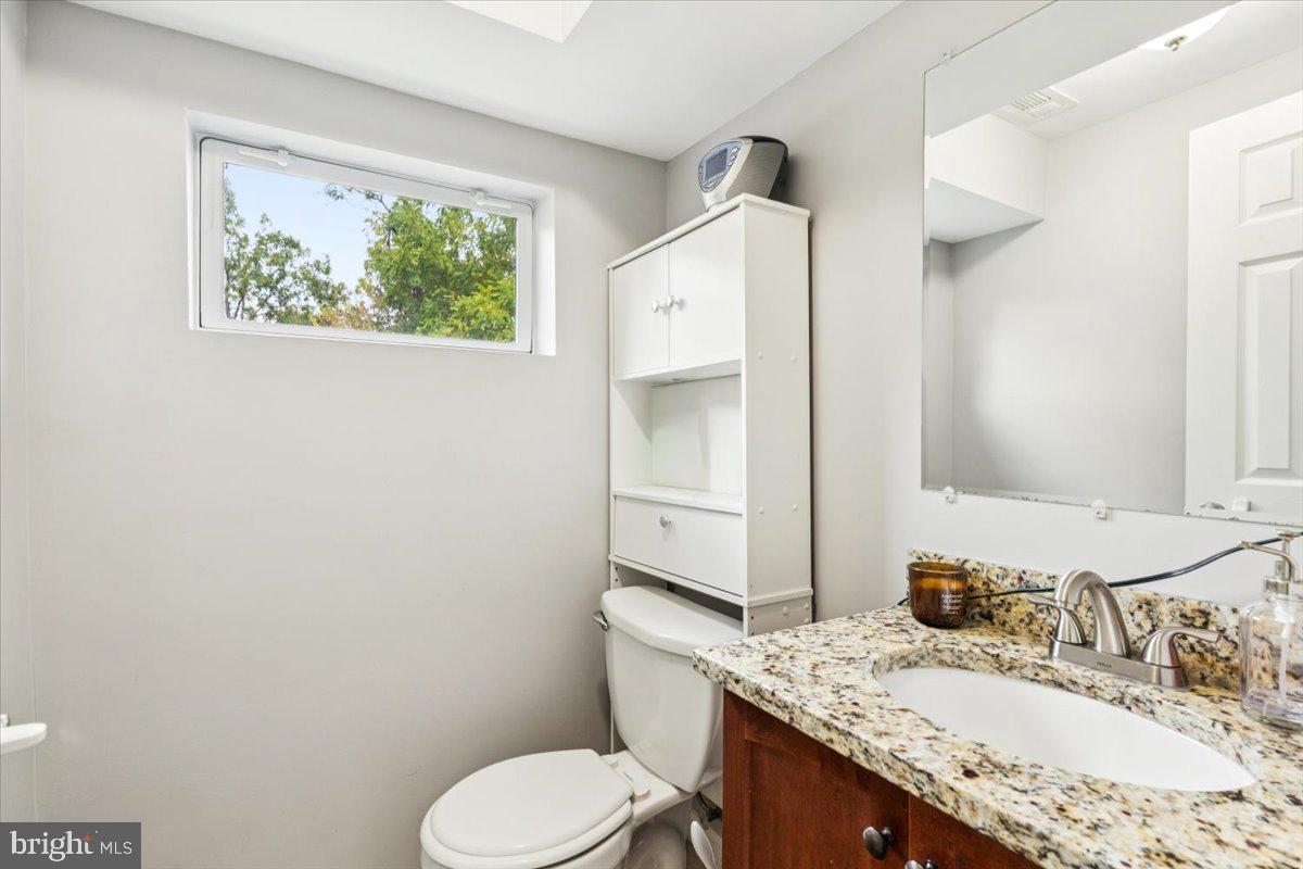 7830 Fingerboard Road Frederick, MD 21704 - Photo 24 of 39 a bathroom with a granite countertop toilet sink and mirror