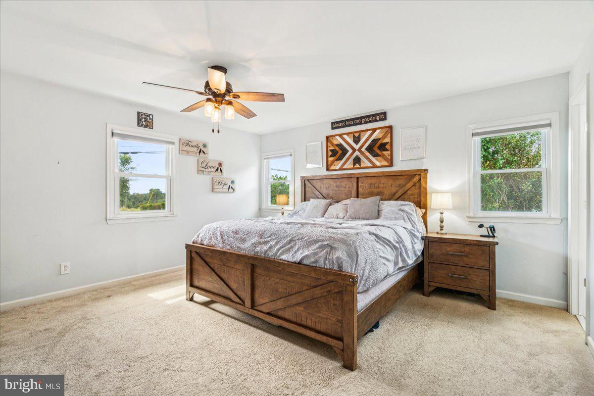 7830 Fingerboard Road Frederick, MD 21704 - Photo 10 of 39 a bedroom with a bed and a window