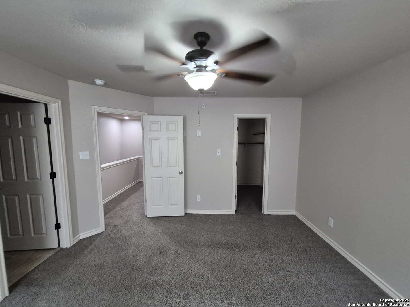7315 Colina Way, Unit 103 Converse, TX 78109 - Photo 16 of 32 an empty room with closet and a chandelier fan