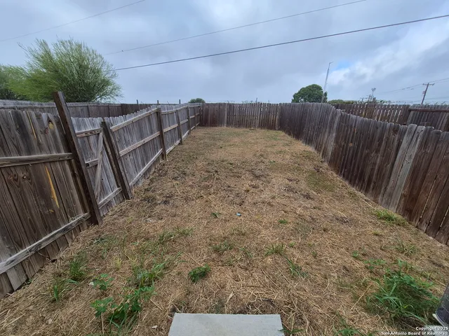 a view of balcony with wooden fence