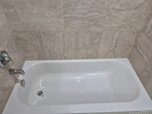 a bathroom with a bathtub