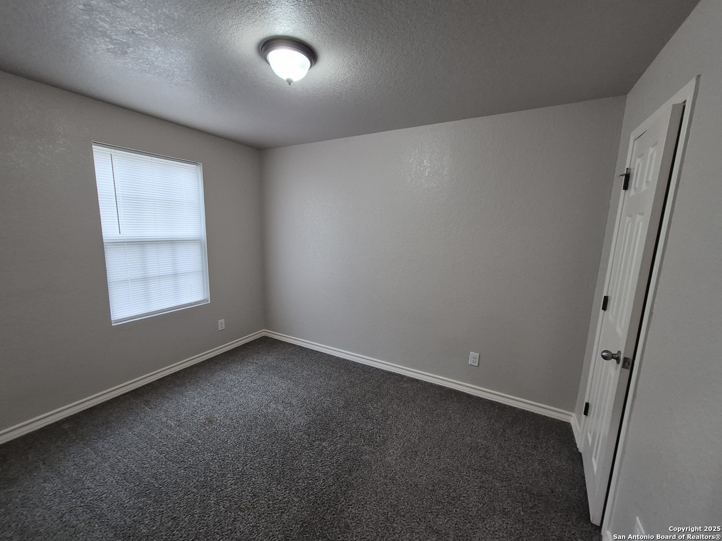 7315 Colina Way, Unit 103 Converse, TX 78109 - Photo 22 of 32 an empty room with windows