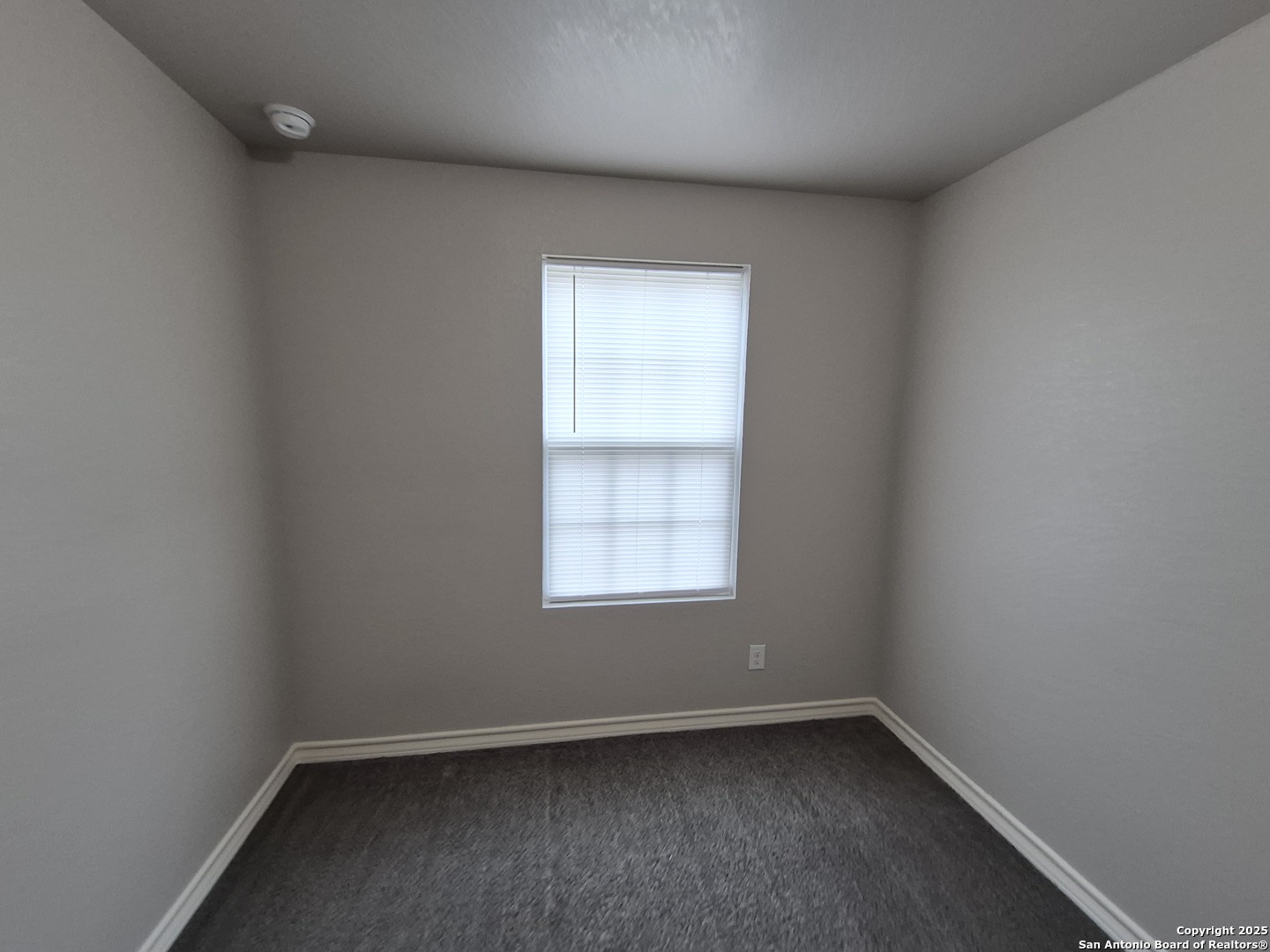 7315 Colina Way, Unit 103 Converse, TX 78109 - Photo 23 of 32 an empty room with a window