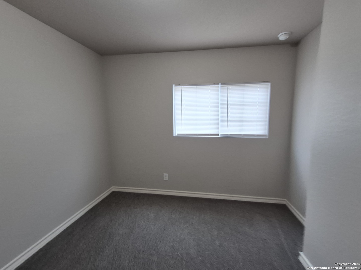 7315 Colina Way, Unit 103 Converse, TX 78109 - Photo 26 of 32 an empty room with a window