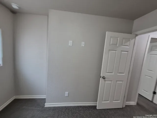 an empty room with a door