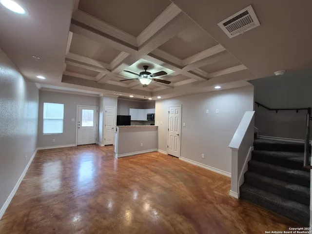 a view of entryway and kitchen