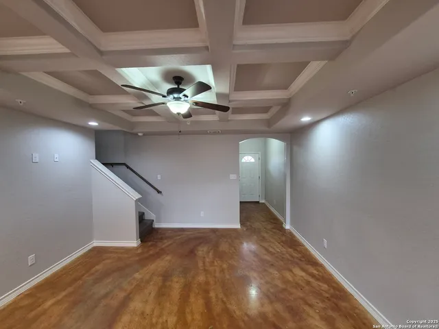 an empty room with wooden floor