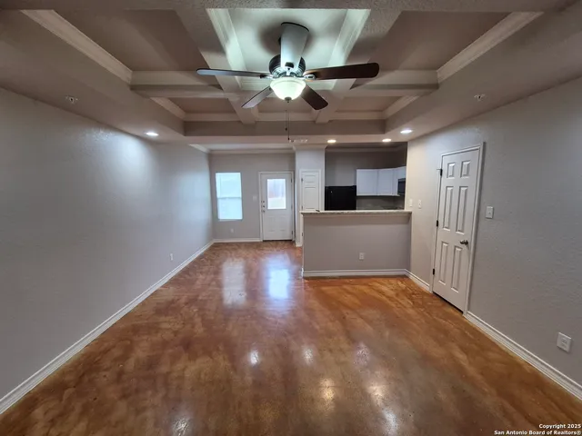 a view of a kitchen with a stove cabinets and a ceiling fan