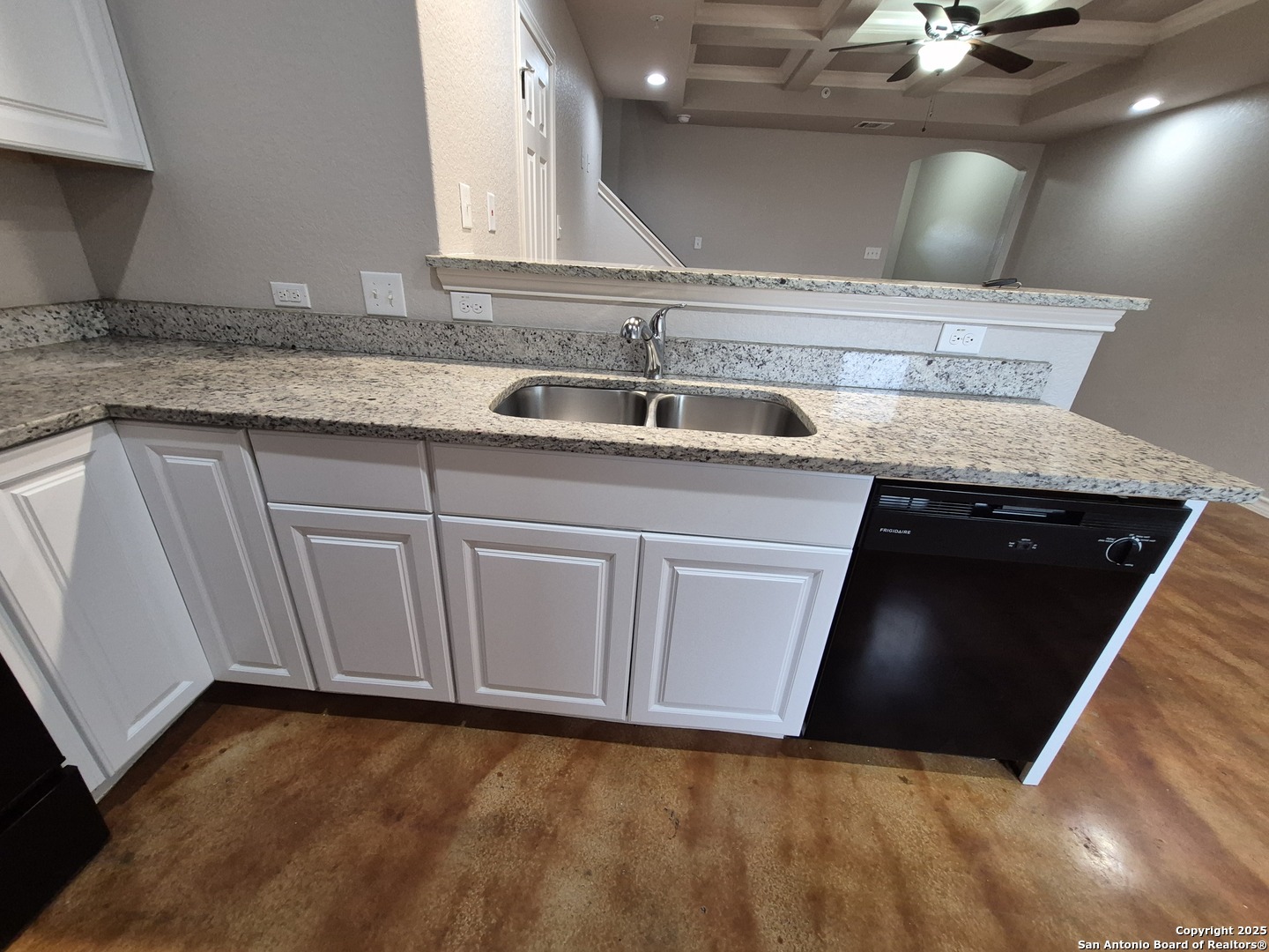 7315 Colina Way, Unit 103 Converse, TX 78109 - Photo 10 of 32 a kitchen with a sink and cabinets