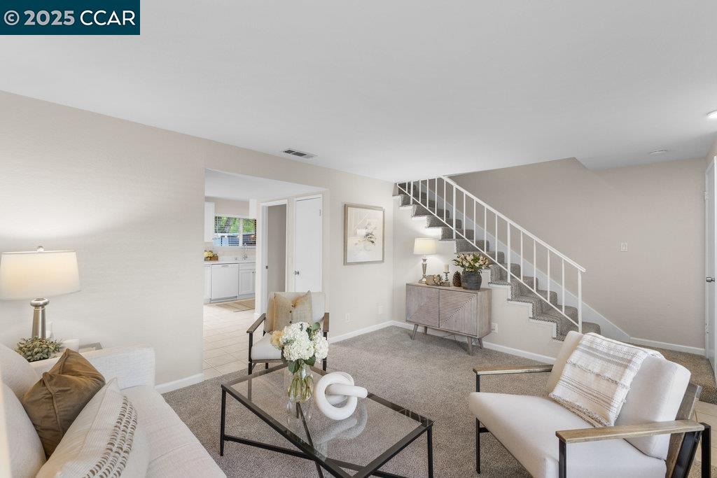 1048 Spring Valley Common Livermore, CA 94551 - Photo 11 of 37 a living room with furniture and a table