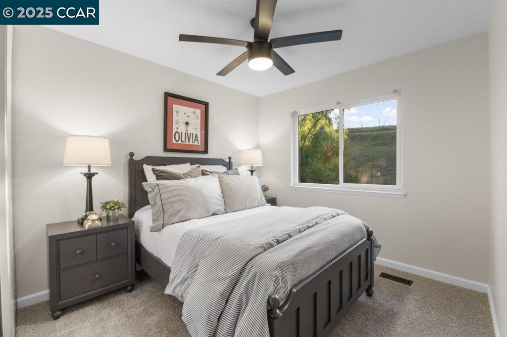 1048 Spring Valley Common Livermore, CA 94551 - Photo 26 of 37 a bedroom with a bed and a window