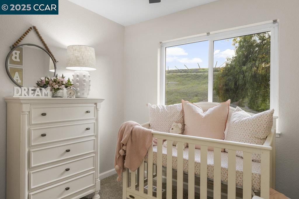 1048 Spring Valley Common Livermore, CA 94551 - Photo 29 of 37 a bed sitting in a bedroom next to a window