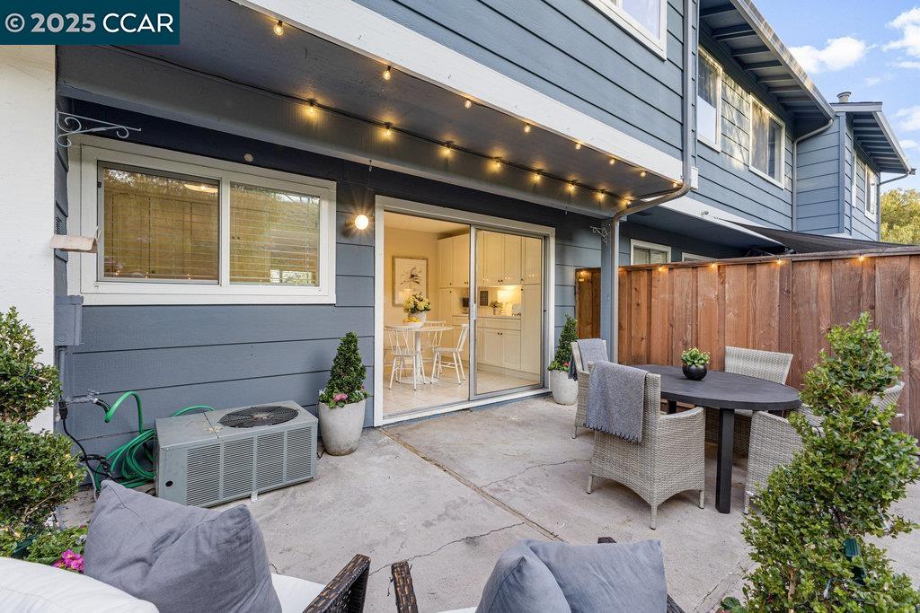 1048 Spring Valley Common Livermore, CA 94551 - Photo 4 of 37 a balcony with furniture and a potted plant