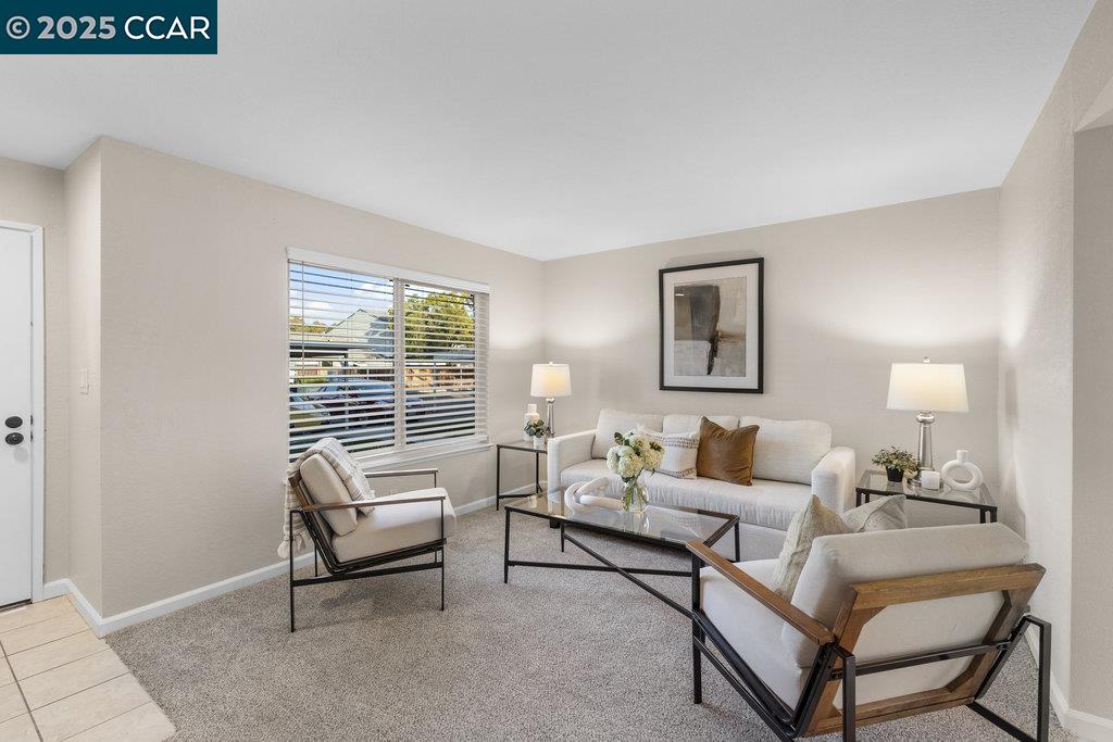 1048 Spring Valley Common Livermore, CA 94551 - Photo 9 of 37 a living room with furniture and a window