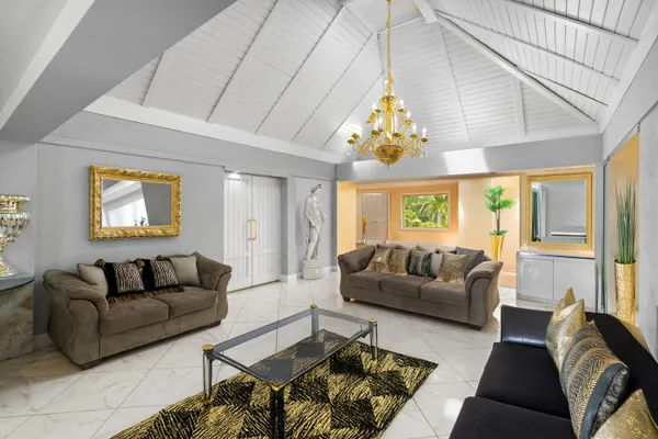 a bedroom with furniture and a flat screen tv