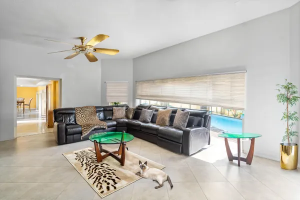 a living room with a couch and a chandelier