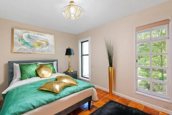 a view of an entryway with a tub and a potted plant