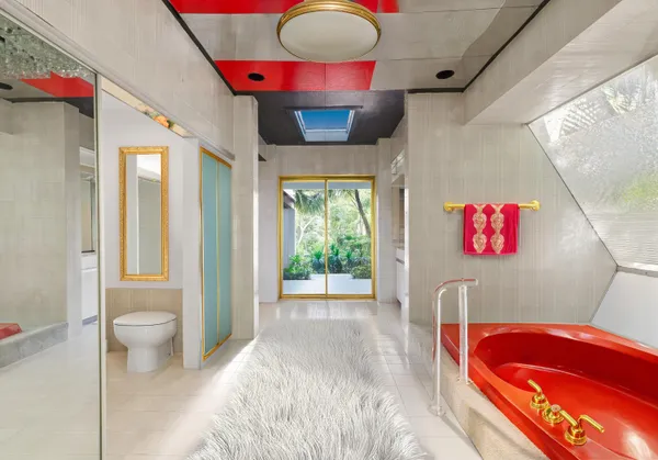 a bathroom with a toilet sink and shower