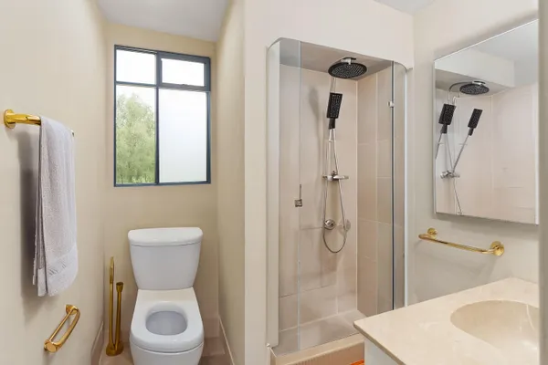 a kitchen with a refrigerator a sink and a stove top oven