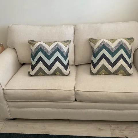 a bedroom with a couch and a couch