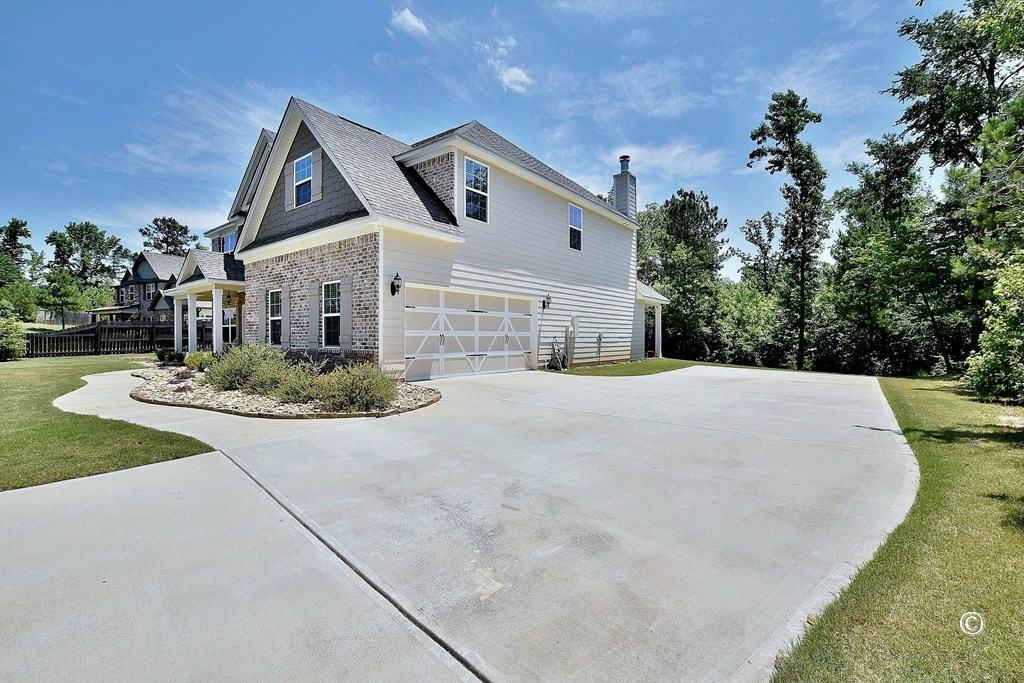 57 Hart Ridge Court Hamilton, GA 31811 - Photo 3 of 33 Side View with Extra Parking Pad