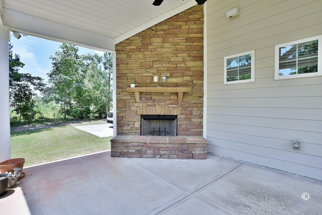 57 Hart Ridge Court Hamilton, GA 31811 - Photo 31 of 33 Covered Game Day Patio with Fireplace