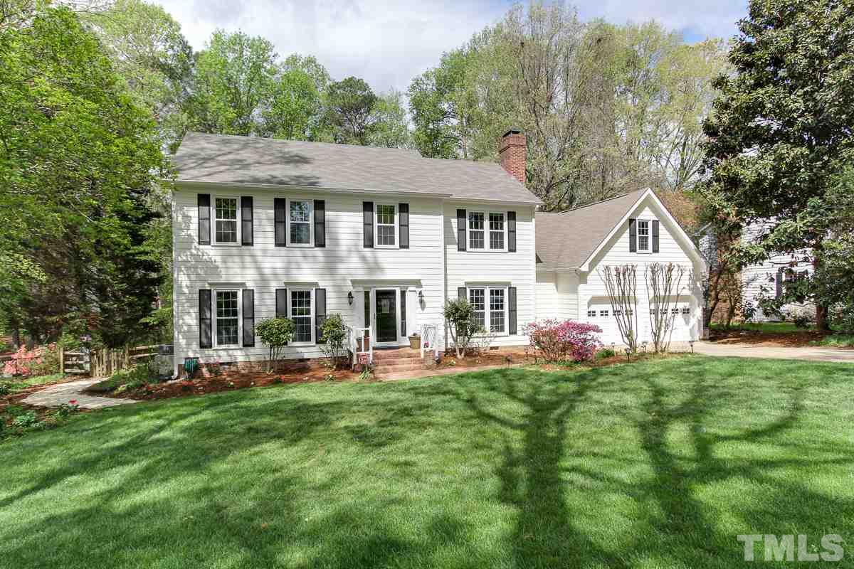 2000 Corberrie Lane Raleigh, NC 27613 - Photo 2 of 25 a front view of a house with a yard and trees