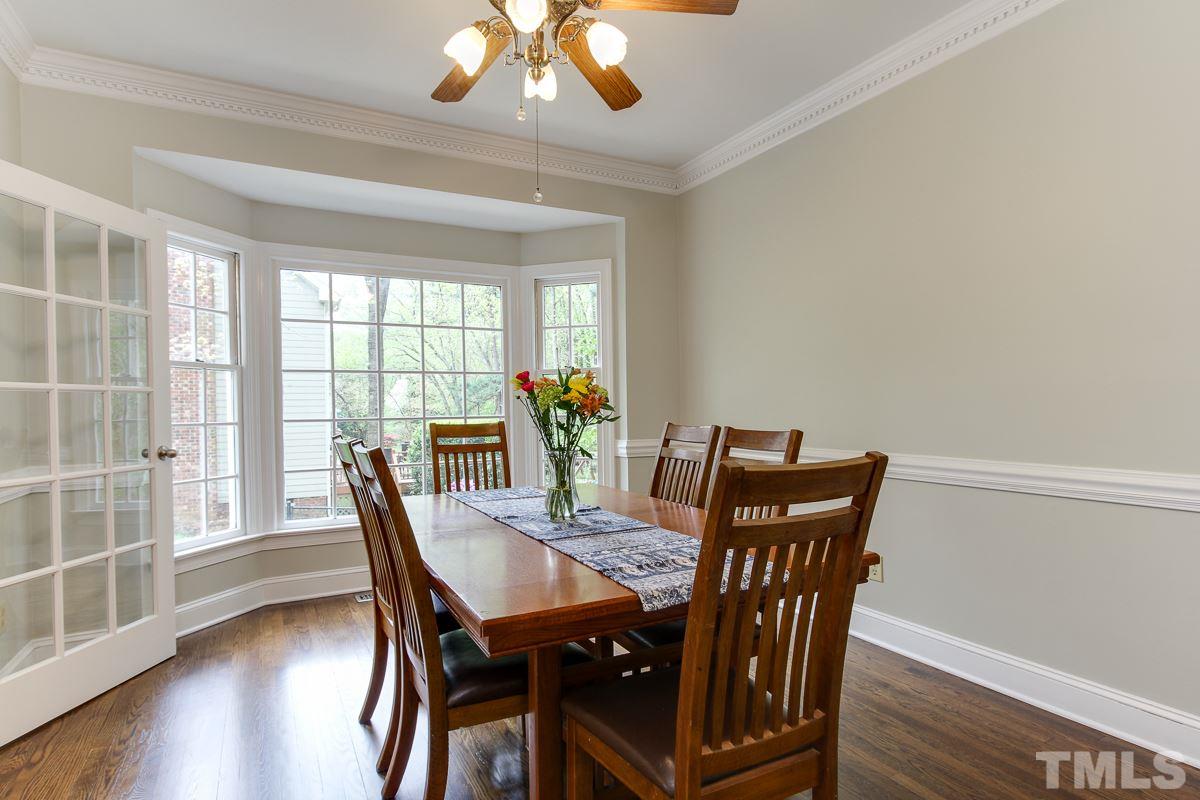 2000 Corberrie Lane Raleigh, NC 27613 - Photo 12 of 25 a view of a dining room with furniture window and wooden floor
