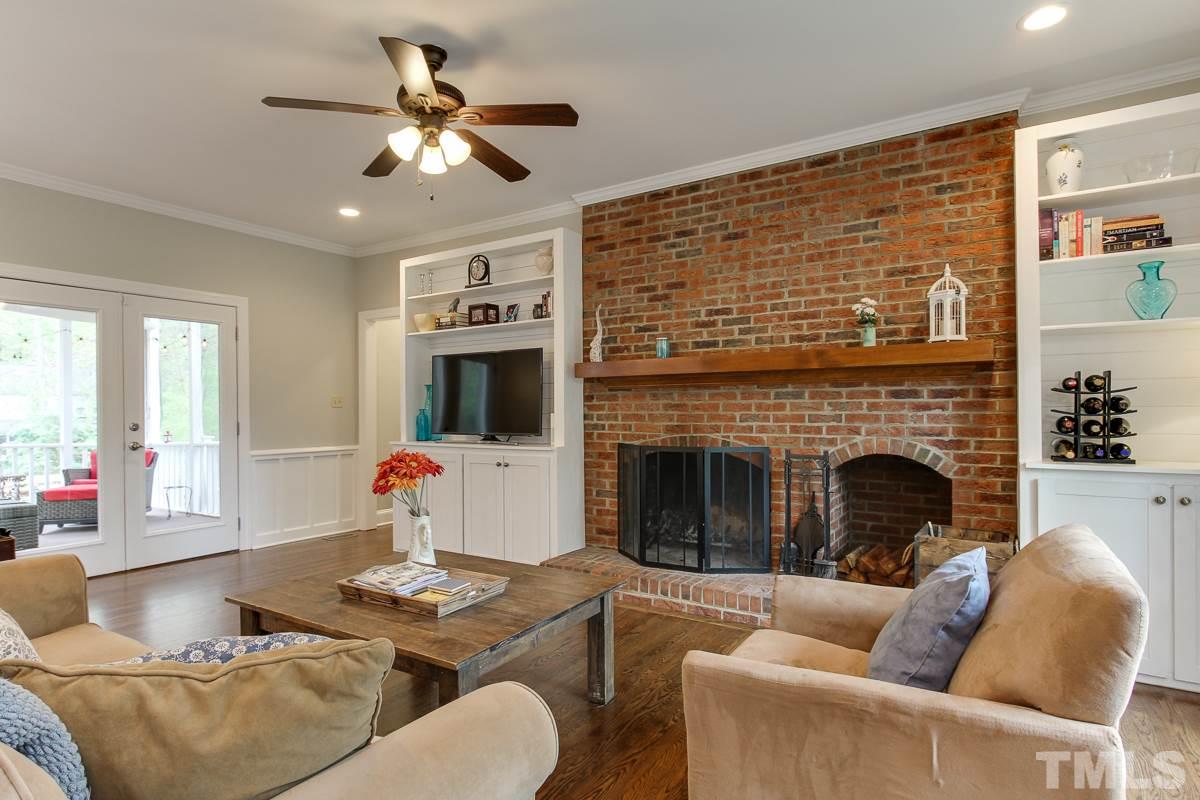 2000 Corberrie Lane Raleigh, NC 27613 - Photo 6 of 25 a living room with furniture and a fireplace