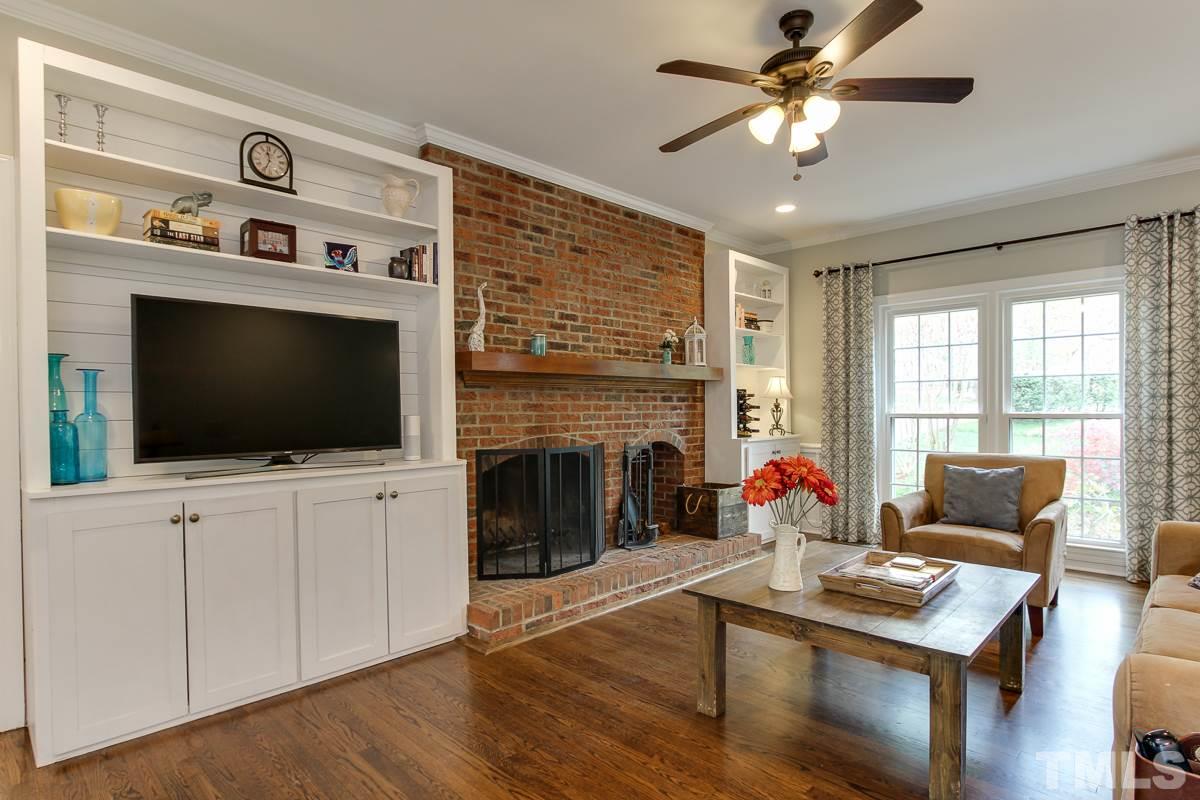 2000 Corberrie Lane Raleigh, NC 27613 - Photo 7 of 25 a living room with furniture and a flat screen tv