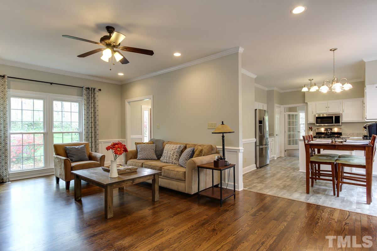 2000 Corberrie Lane Raleigh, NC 27613 - Photo 8 of 25 a living room with furniture and a large window
