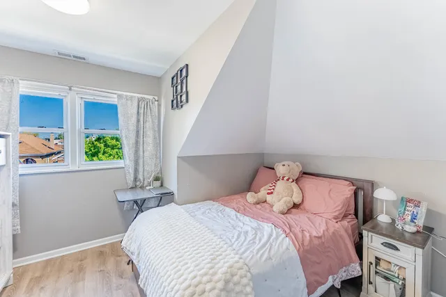 a bedroom with a bed and cabinets