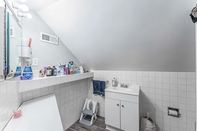 a kitchen with a refrigerator and a stove