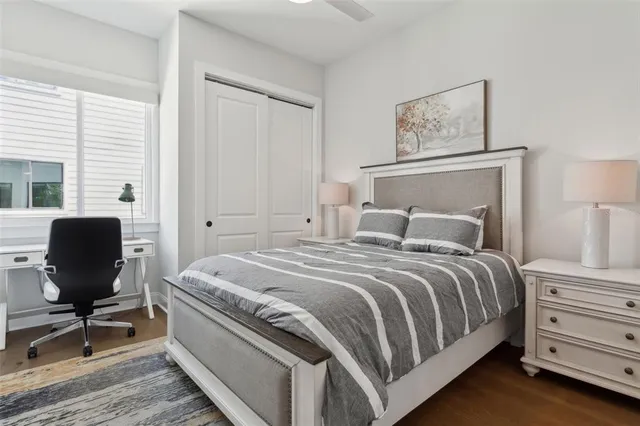 a bedroom with a bed and chair