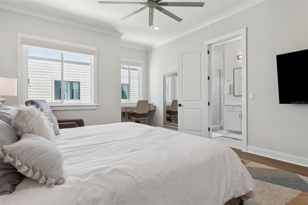 4515 West North A Street, Unit 2 Tampa, FL 33609 - Photo 18 of 21 a spacious bedroom with a bed and a flat tv screen