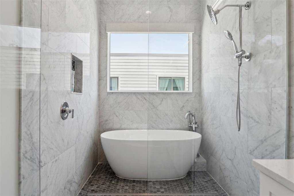 4515 West North A Street, Unit 2 Tampa, FL 33609 - Photo 20 of 21 a white bath tub sitting next to a white sink